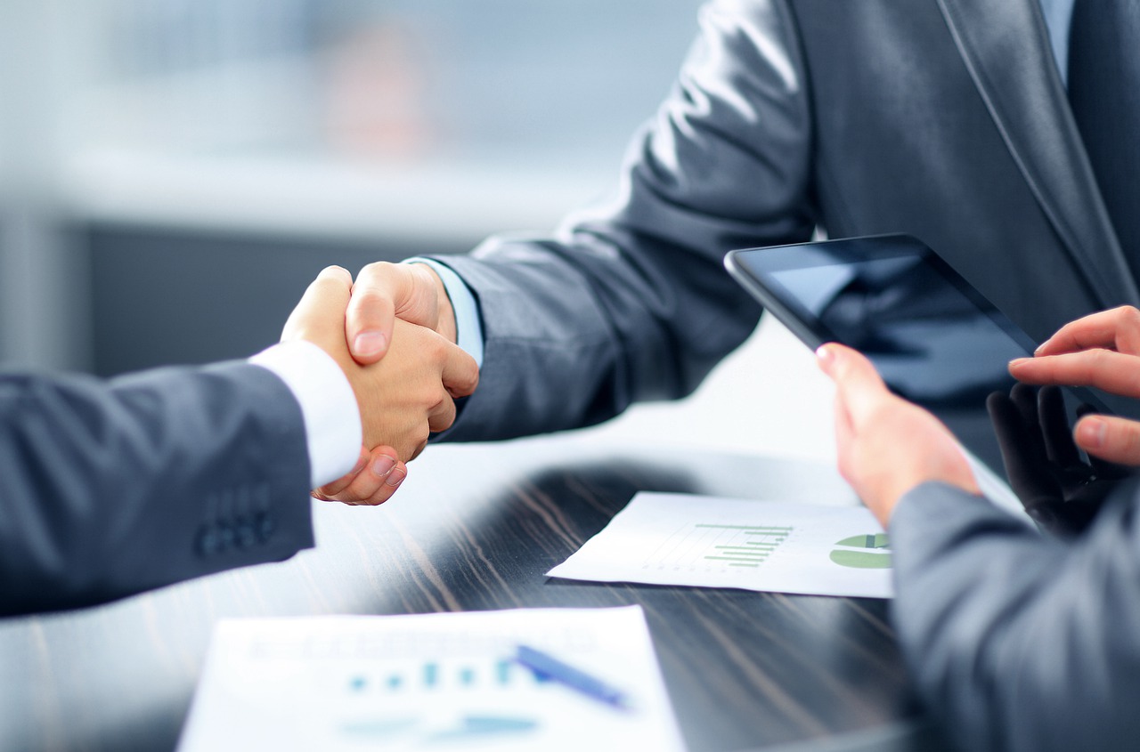 An adviser supporting a client in a meeting